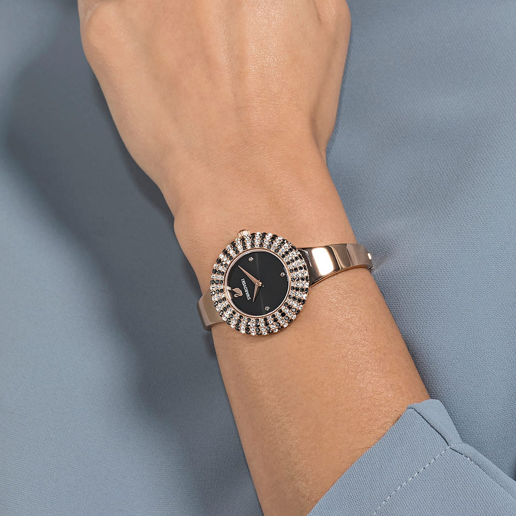 Crystal Rose watch worn on wrist showing black dial with rose gold hands and crystal bezel