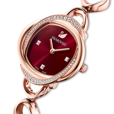 Swarovski Crystalline Aura watch at angle showing burgundy dial and pave crystal case