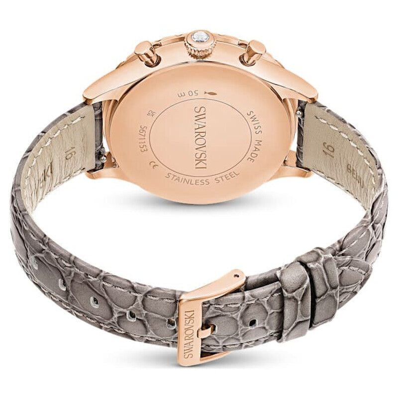 Caseback of Crystalline Aura watch showing rose-gold stainless steel case and grey leather strap