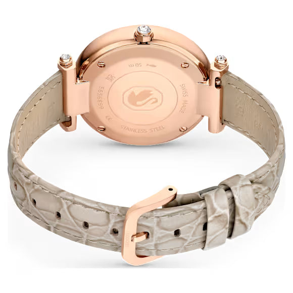 Caseback of Swarovski Crystalline Wonder watch showing rose gold PVD case and beige leather strap