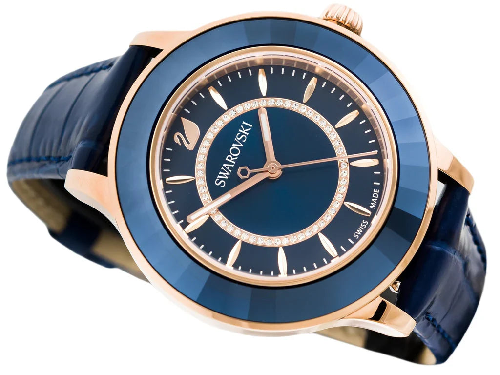 Angled view of Swarovski Octea Lux women's watch with blue dial and rose gold bezel