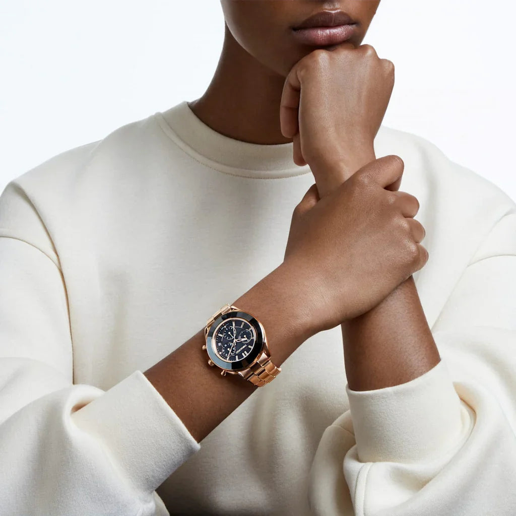 Octea Lux Sport chronograph watch worn on wrist, showing rose gold case and black dial