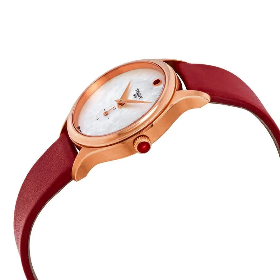 Tissot Bella Ora watch on wrist with burgundy leather strap and rose gold case