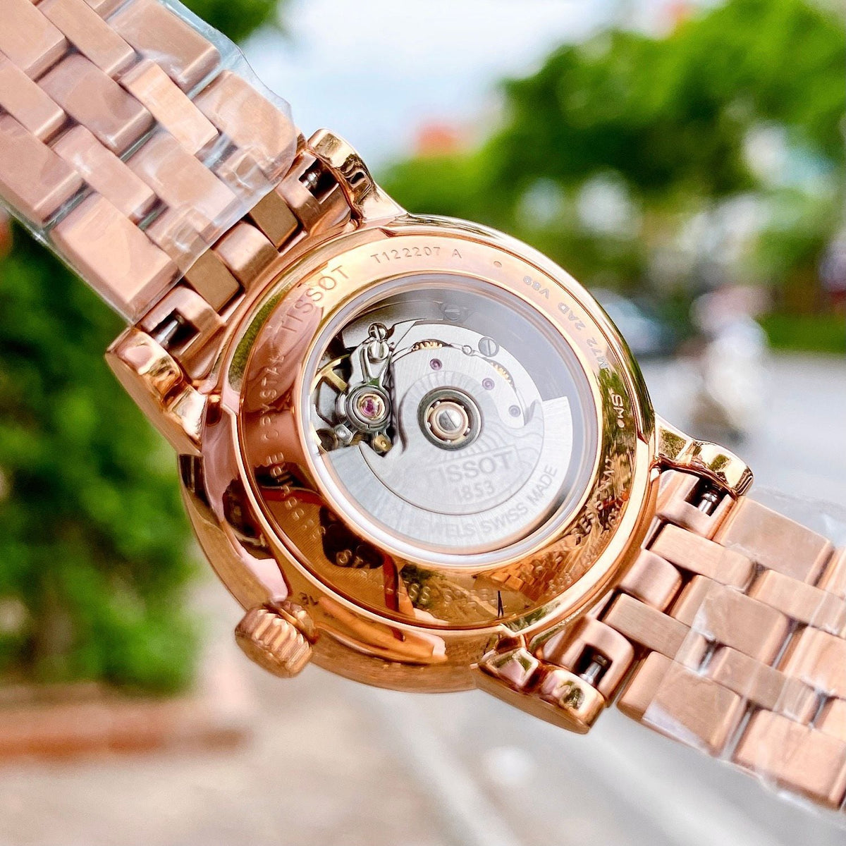 Tissot Carson Premium caseback displaying automatic movement and rotor through transparent crystal