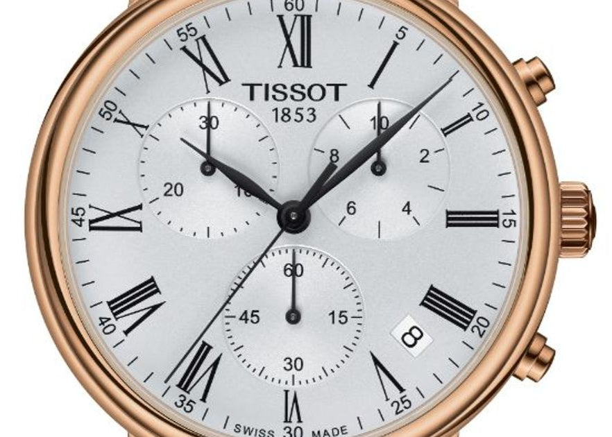 Close-up of Tissot Carson chronograph dial with Roman numerals, subdials, and rose gold hour markers
