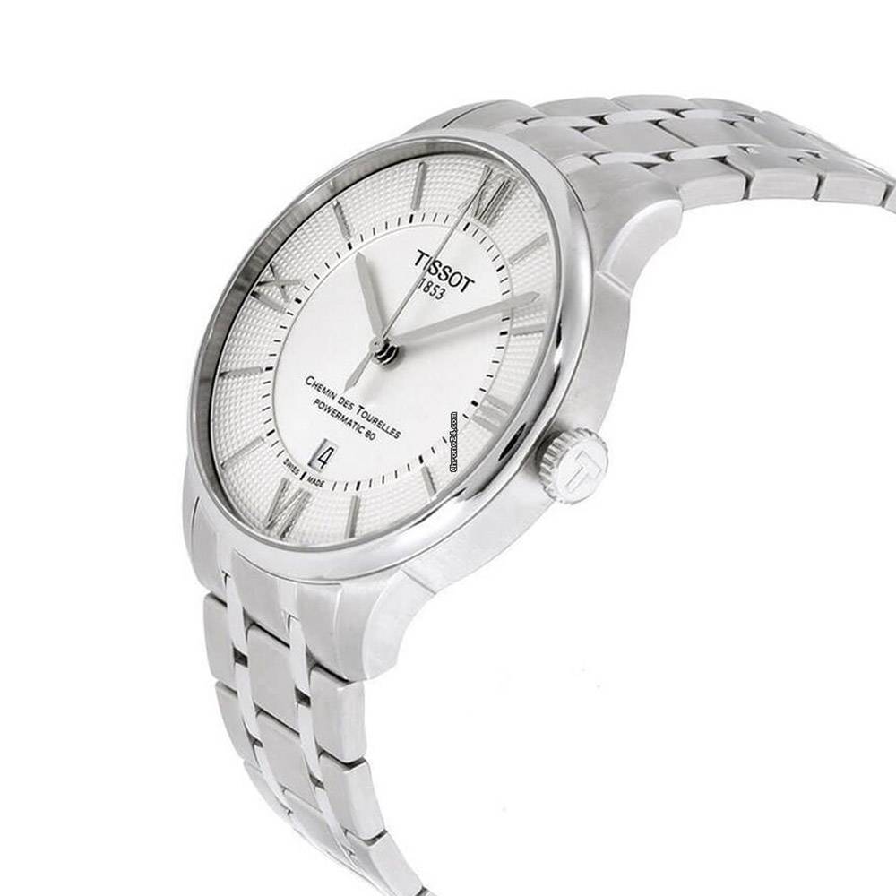 Tissot Chemin Des Tourelles men's watch worn on wrist with stainless steel bracelet