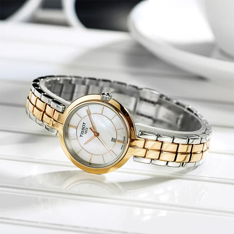 Tissot Flamingo two-tone watch worn on wrist showing mother-of-pearl dial