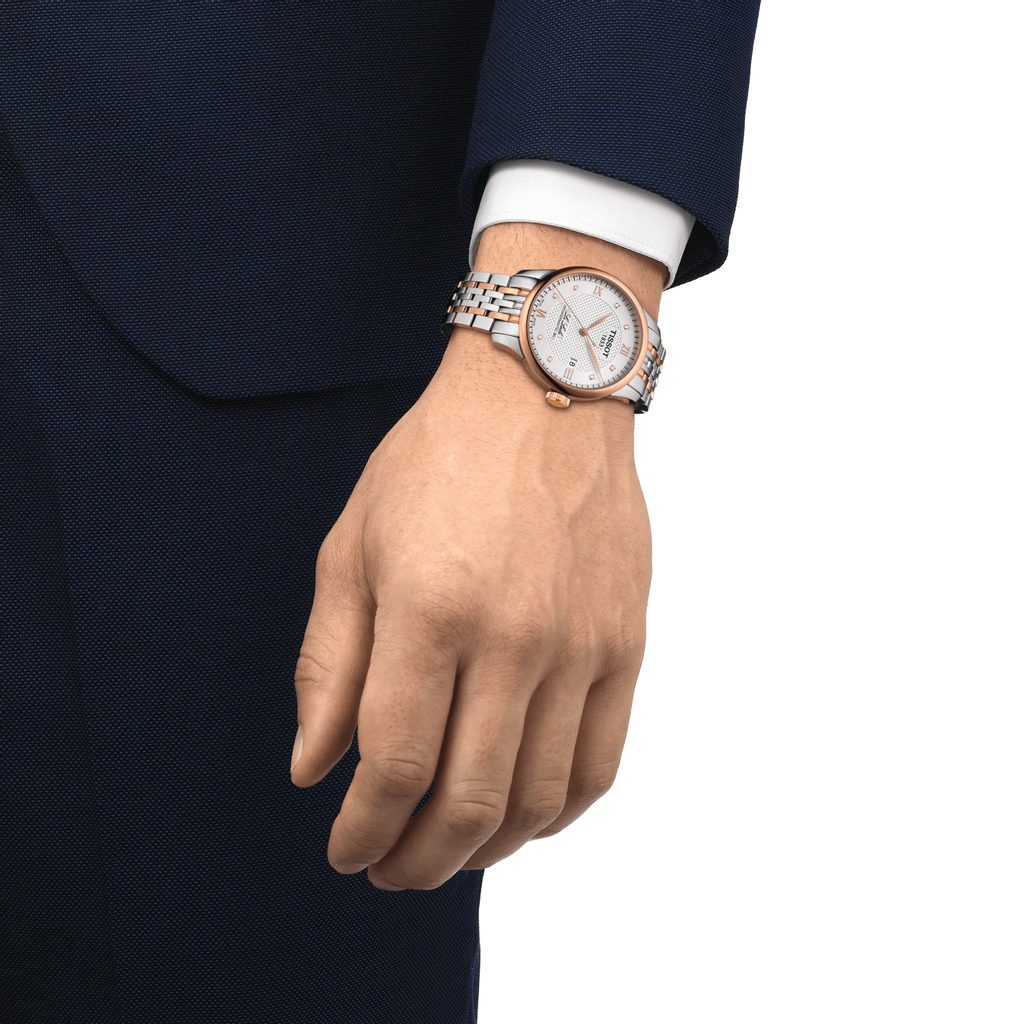Tissot Le Locle Powermatic 80 watch worn on wrist with silver dial and two-tone bracelet