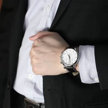 Tissot T Classic Tradition chronograph watch worn on wrist with white dial and steel case