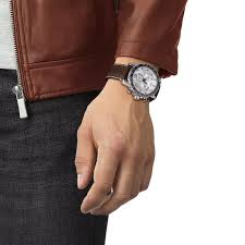 Tissot chronograph watch on wrist with brown leather strap