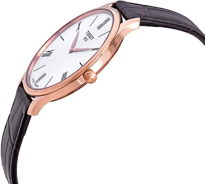 Tissot Tradition 5.5 watch on wrist with brown leather strap