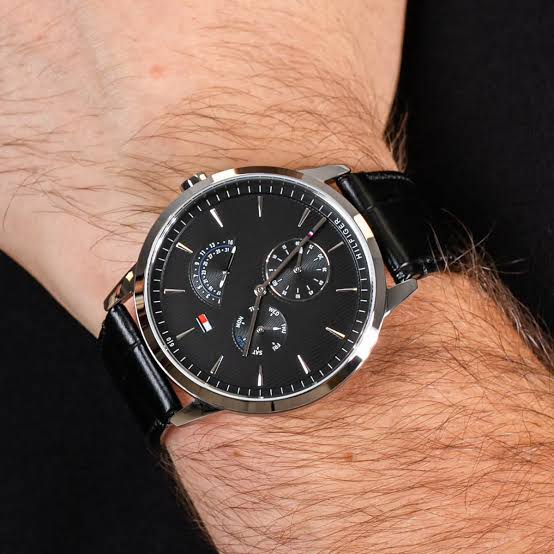 Tommy Hilfiger chronograph watch worn on wrist with black dial and chronograph subdials