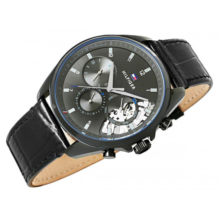 Tommy Hilfiger 1710452 chronograph watch worn on wrist with black leather strap