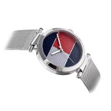Angled view of Tommy Hilfiger watch showing multicolor dial sectors and mesh band
