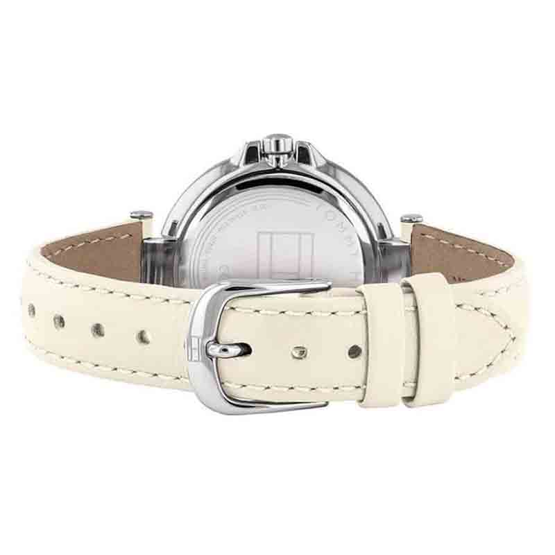Tommy Hilfiger women's watch on wrist showing cream leather strap with buckle closure