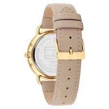 Tommy Hilfiger watch caseback showing gold-tone case and beige leather strap