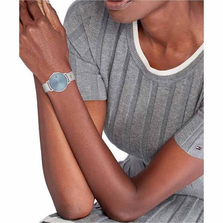Tommy Hilfiger tea blue dial watch worn on wrist with silver mesh band