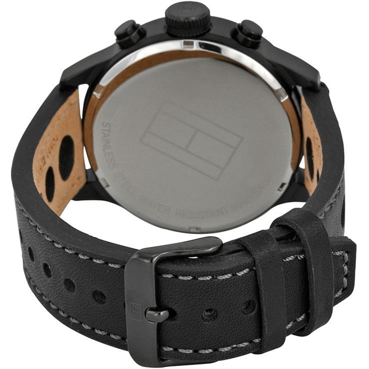 Case back of Tommy Hilfiger watch showing stainless steel with brown leather and strap detail