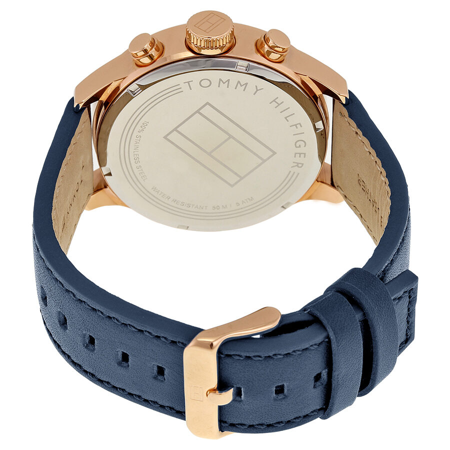 Tommy Hilfiger watch caseback showing engraved branding and blue leather strap with rose gold buckle