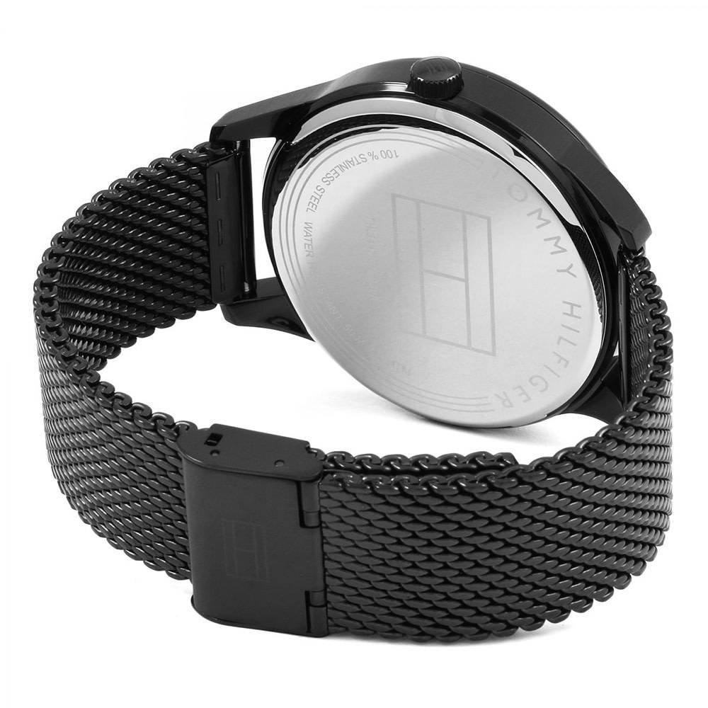 Watch case back showing Tommy Hilfiger branding and engraved details