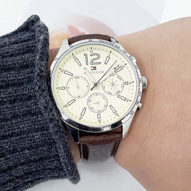 Tommy Hilfiger chronograph watch worn on wrist with brown leather strap