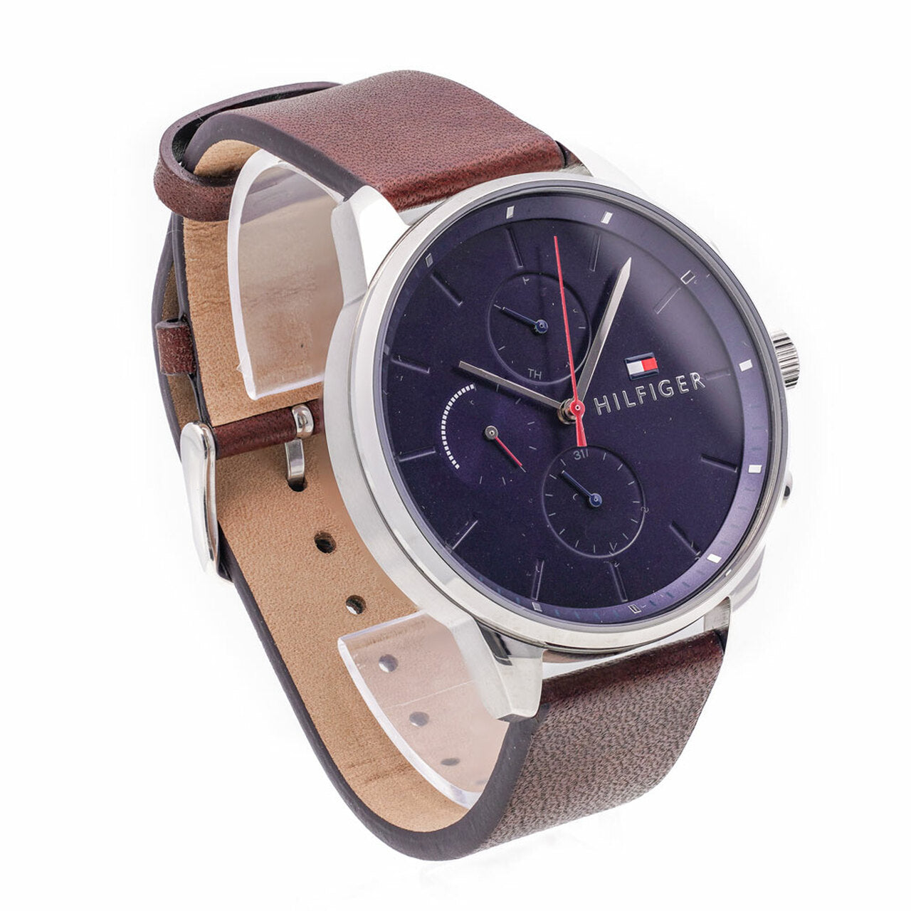 Tommy Hilfiger 1791487 analogue quartz watch worn on wrist with brown leather strap