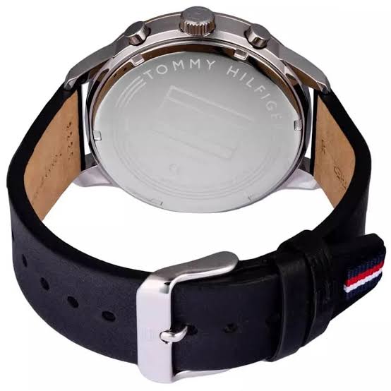 Tommy Hilfiger watch caseback showing stainless steel case with black silicone strap