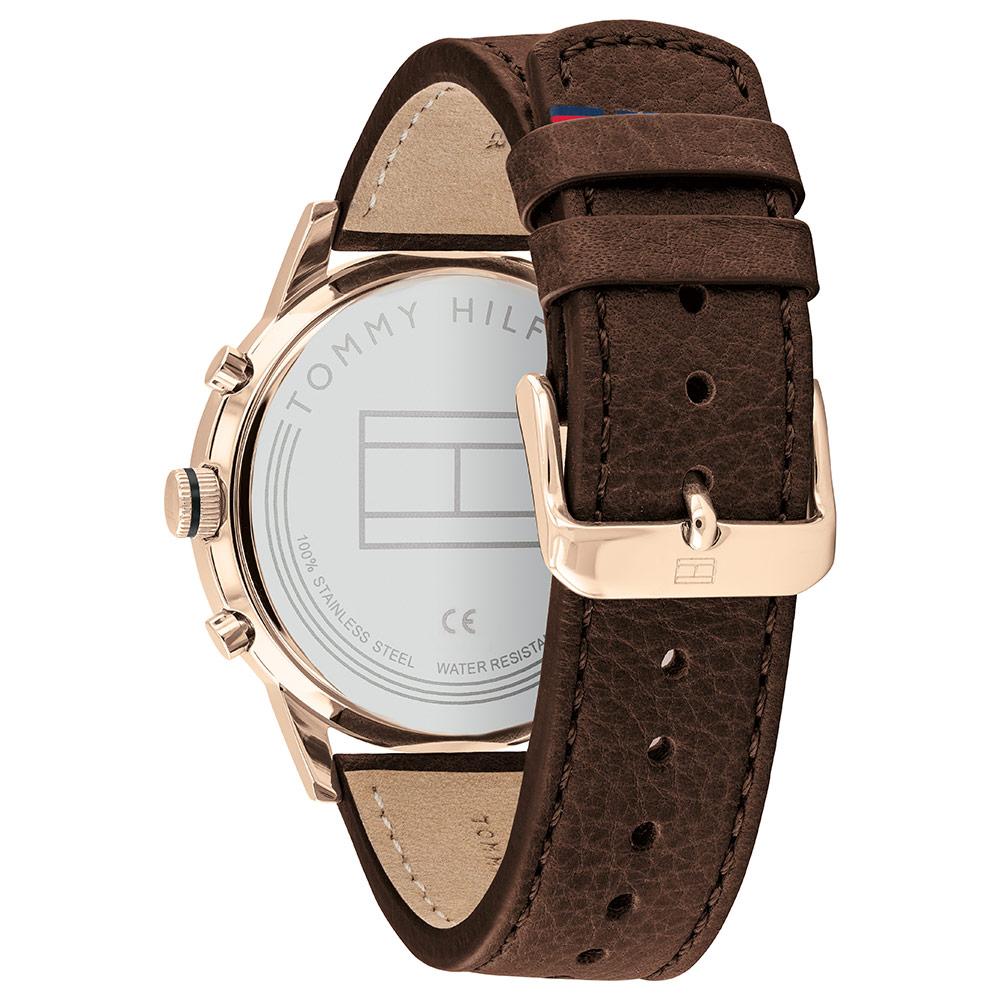 Caseback of Tommy Hilfiger watch showing stainless steel case back and dark brown leather strap
