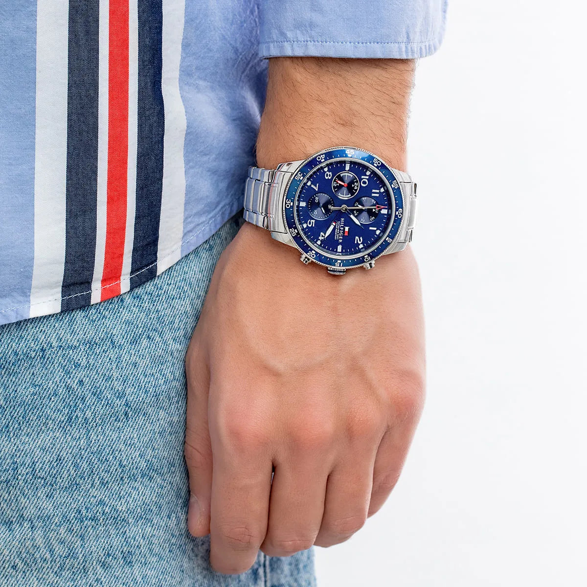 Tommy Hilfiger 1791949 chronograph watch worn on wrist with blue dial visible