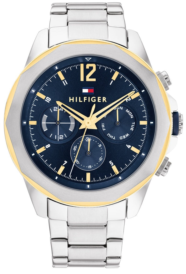 Tommy Hilfiger chronograph watch with navy dial, gold bezel, and silver stainless steel bracelet