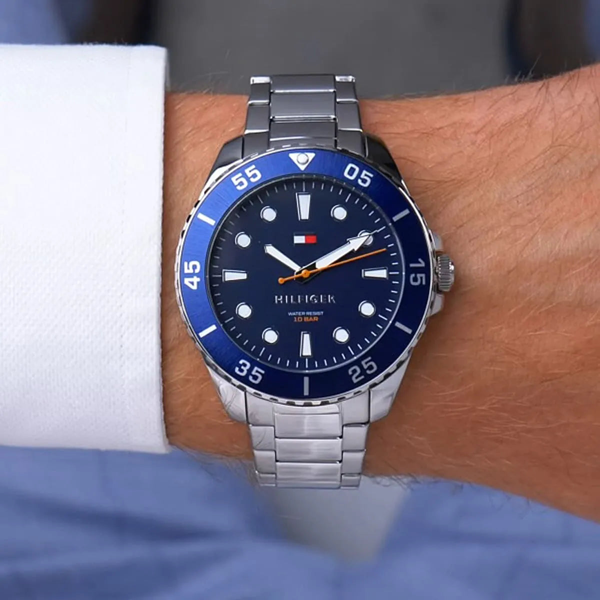 Tommy Hilfiger Oceanic watch worn on wrist showing blue dial and rotating bezel detail