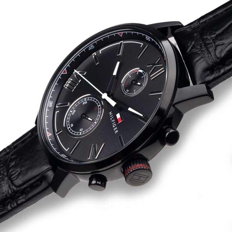 Close-up of Tommy Hilfiger Alden dial with Roman numerals, chronograph pushers, and subdials