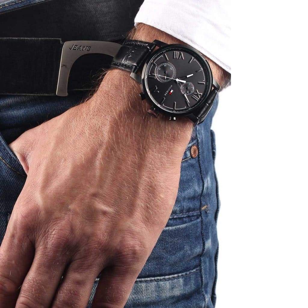 Tommy Hilfiger Alden black chronograph watch worn on wrist with black leather strap