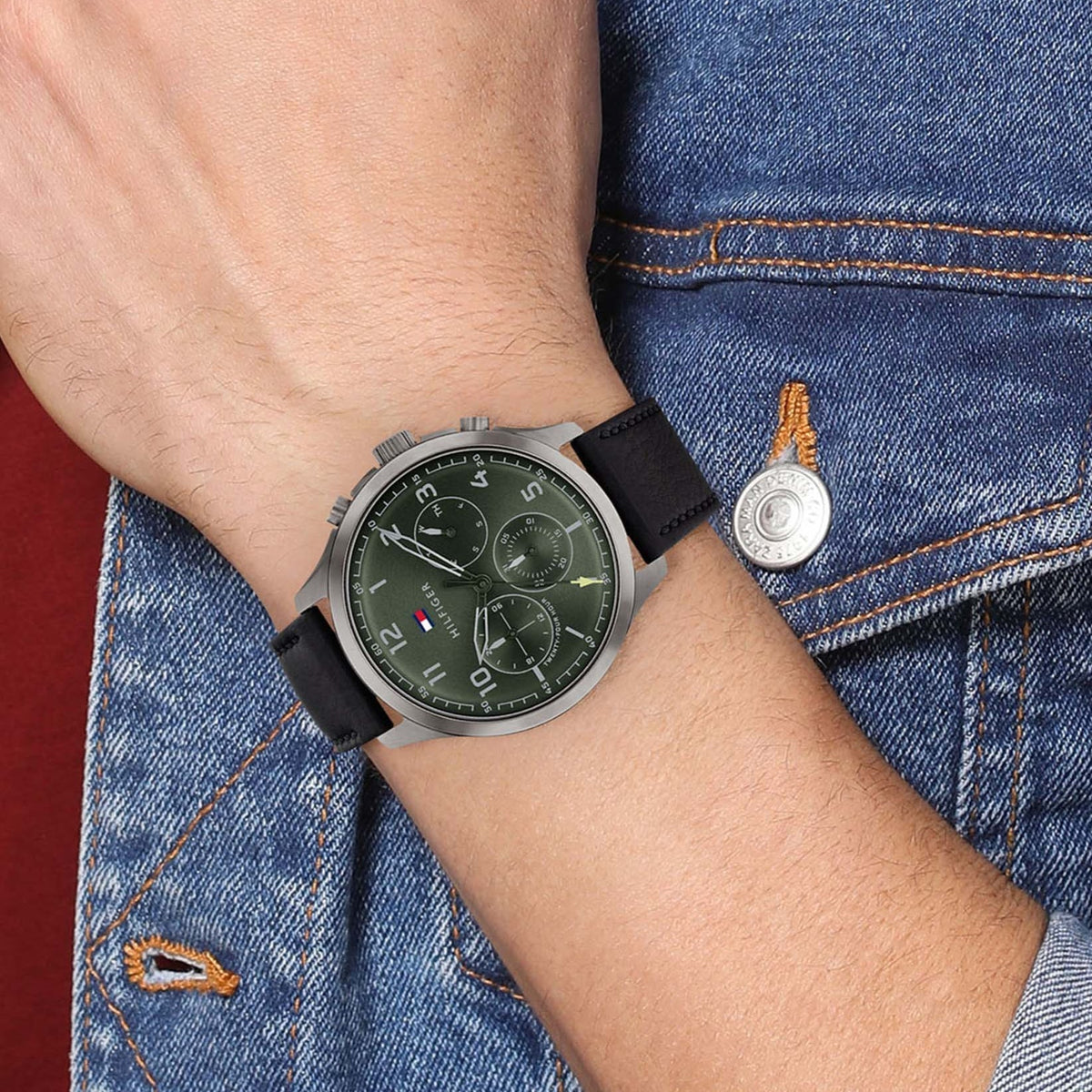 Tommy Hilfiger Asher watch with green dial on wrist with black leather strap