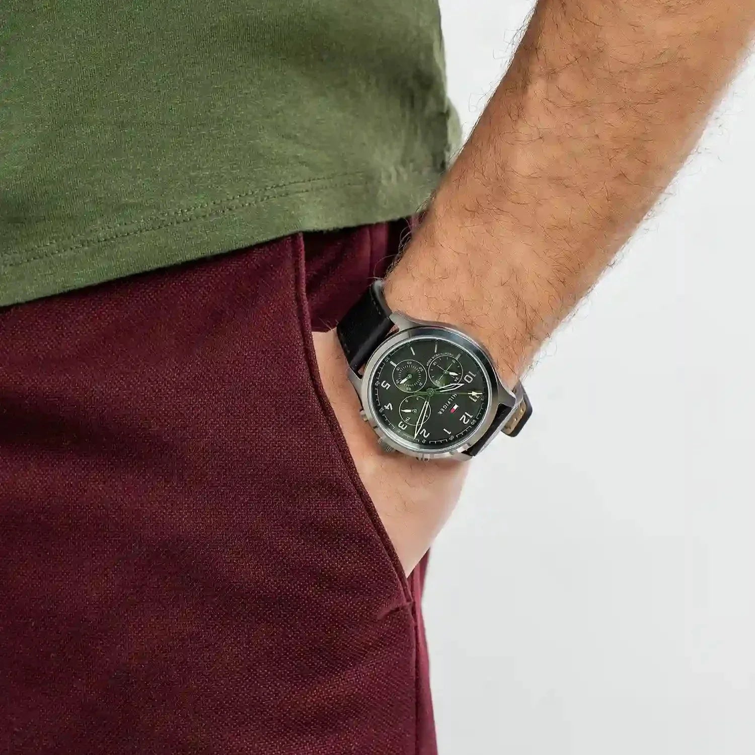 Tommy Hilfiger Asher chronograph watch on wrist showing green dial