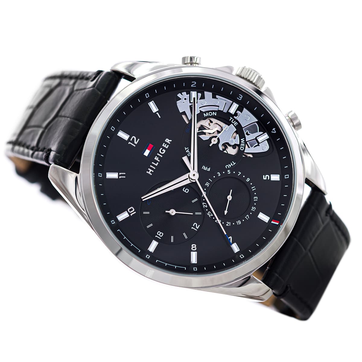 Tommy Hilfiger Baker chronograph at angle displaying black leather strap and silver-tone case profile