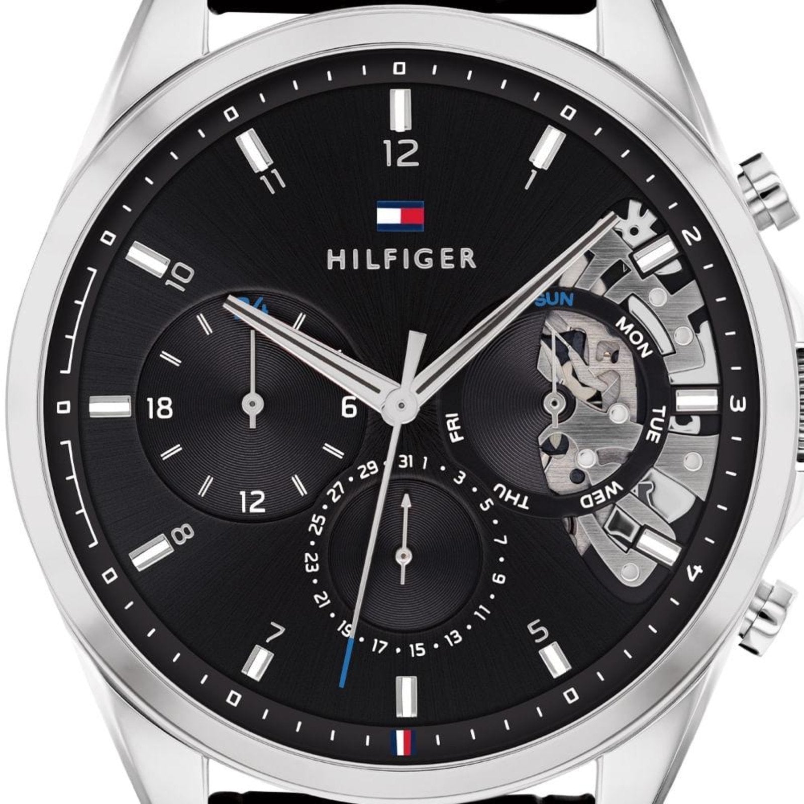 Close-up of Baker chronograph dial showing hour markers, subdials, and open heart mechanical detail