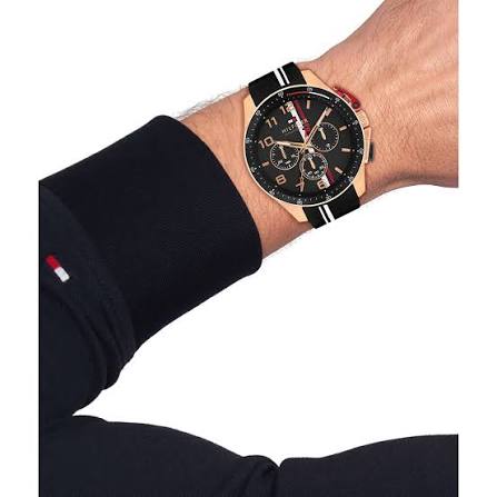 Tommy Hilfiger Bank chronograph watch worn on wrist with rose gold case and black strap