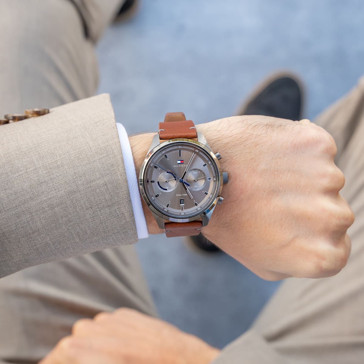 Tommy Hilfiger Bennett watch worn on wrist with grey dial and brown leather strap