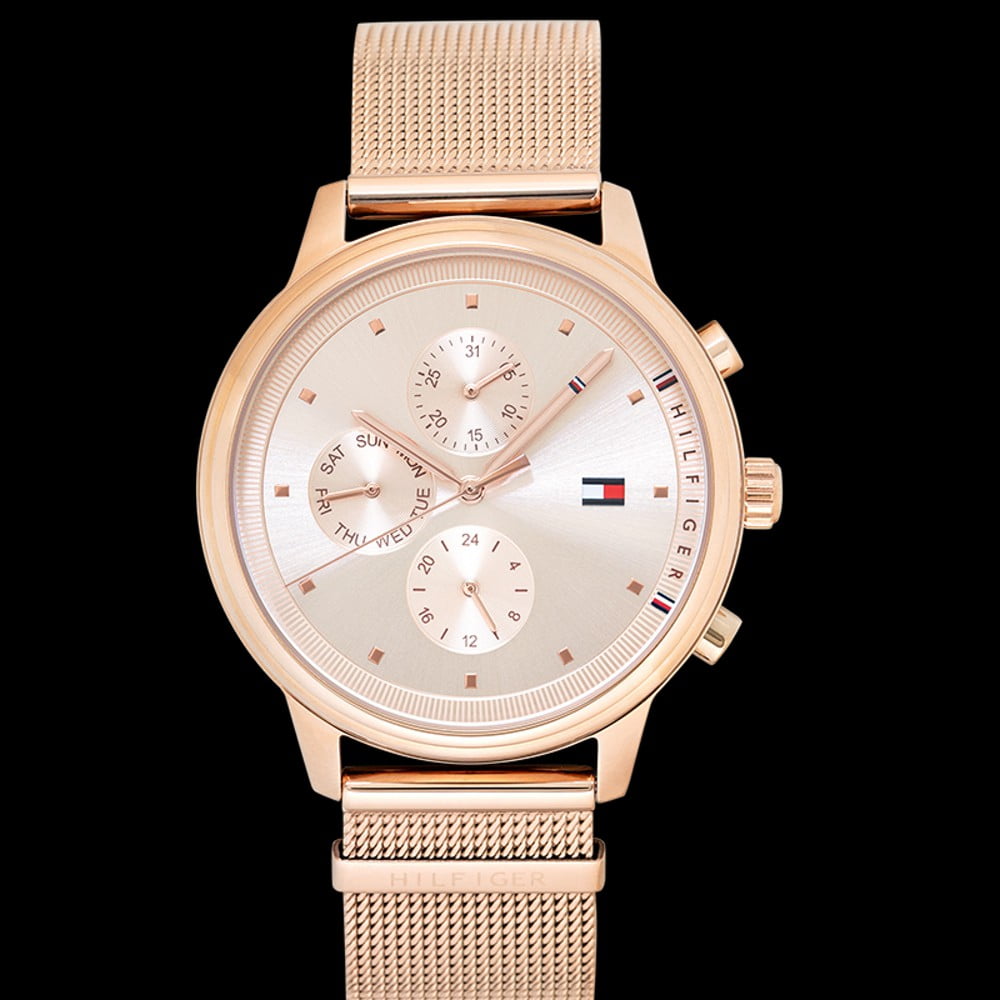 Tommy Hilfiger Blake watch angled view on black background showing rose gold case and mesh band