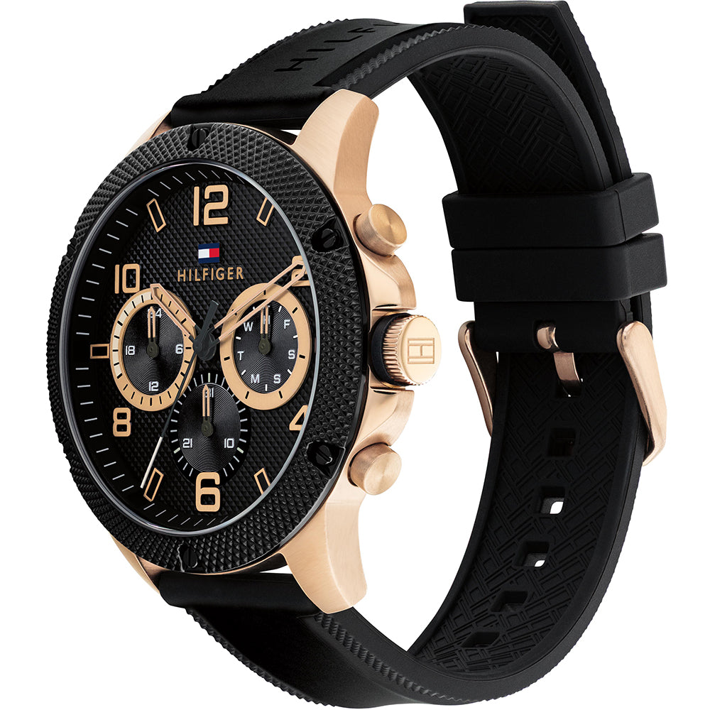 Side angle view of Tommy Hilfiger Blaze watch showing rose gold case and black rubber strap