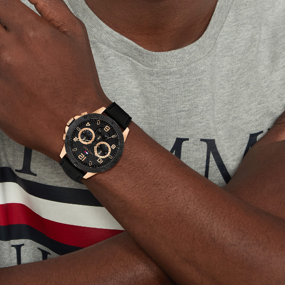 Tommy Hilfiger Blaze chronograph watch on wrist with grey t-shirt and navy stripe