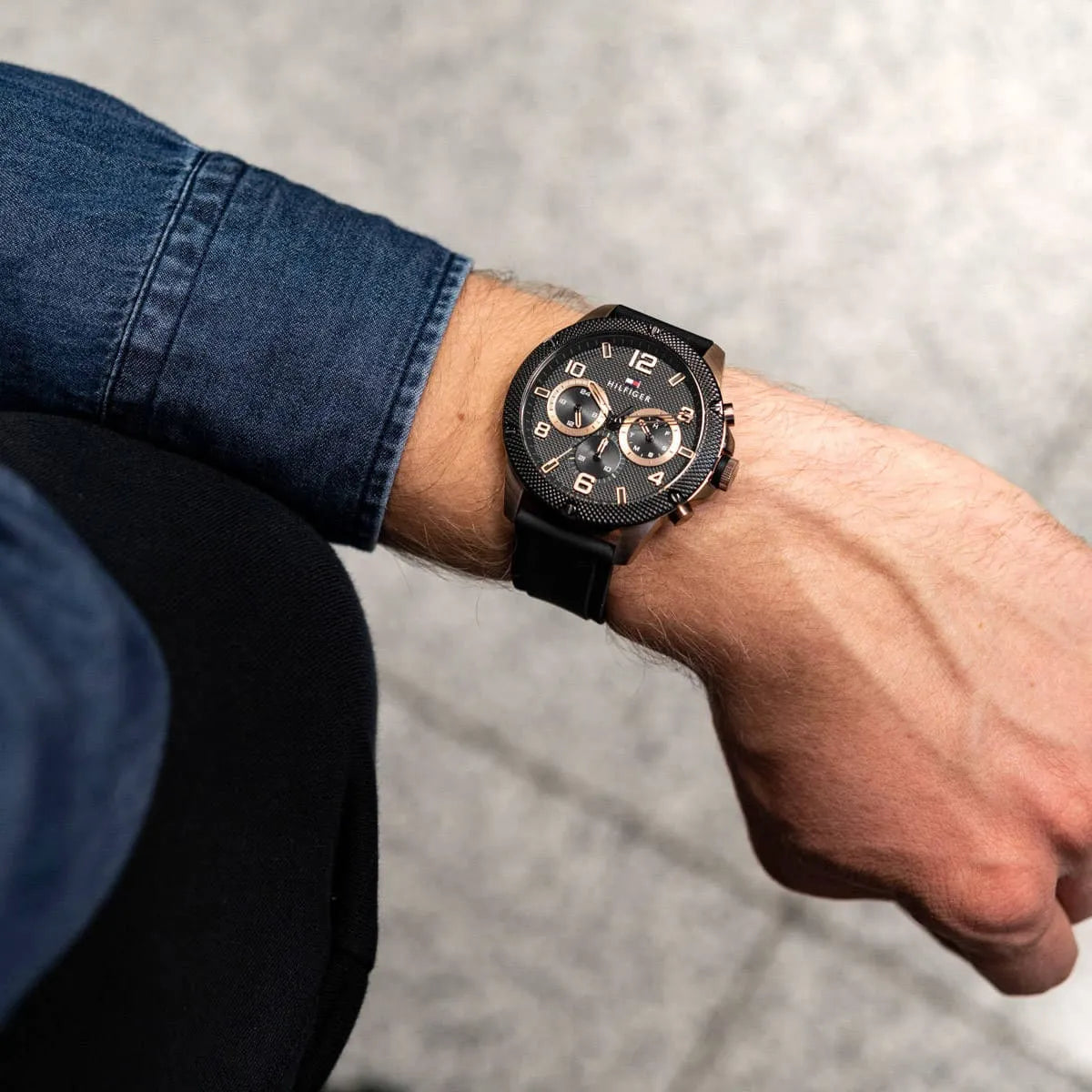 Tommy Hilfiger Blaze multifunction watch worn on wrist with denim sleeve