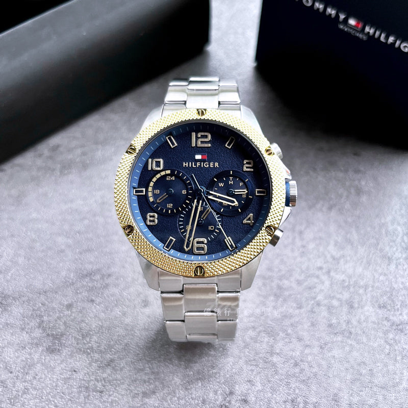 Tommy Hilfiger Blaze watch with blue dial and gold bezel detail view