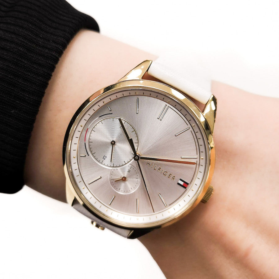 Tommy Hilfiger Brooklyn watch on wrist showing silver dial and white leather strap