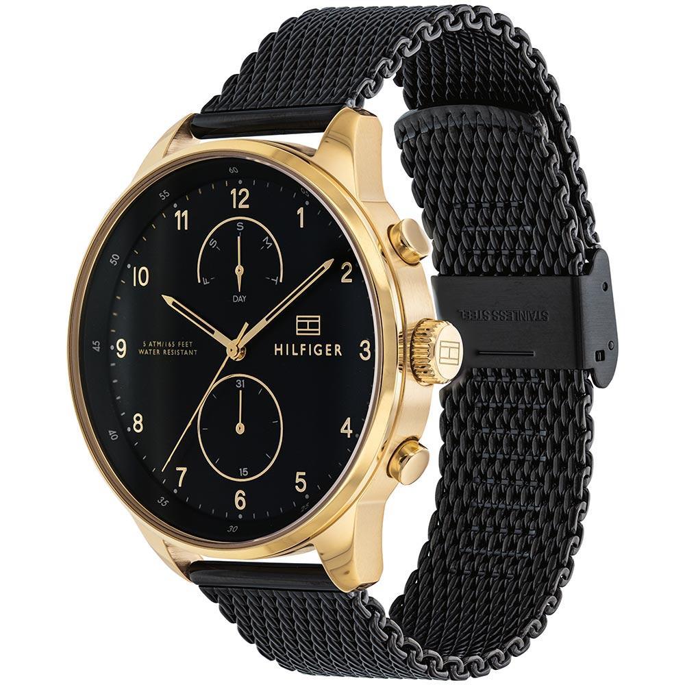 Tommy Hilfiger chronograph watch on wrist showing gold case and black mesh band