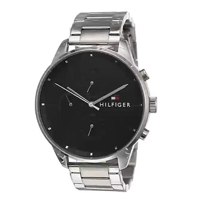 Tommy Hilfiger Chase watch angled view showing silver steel band and black chronograph dial