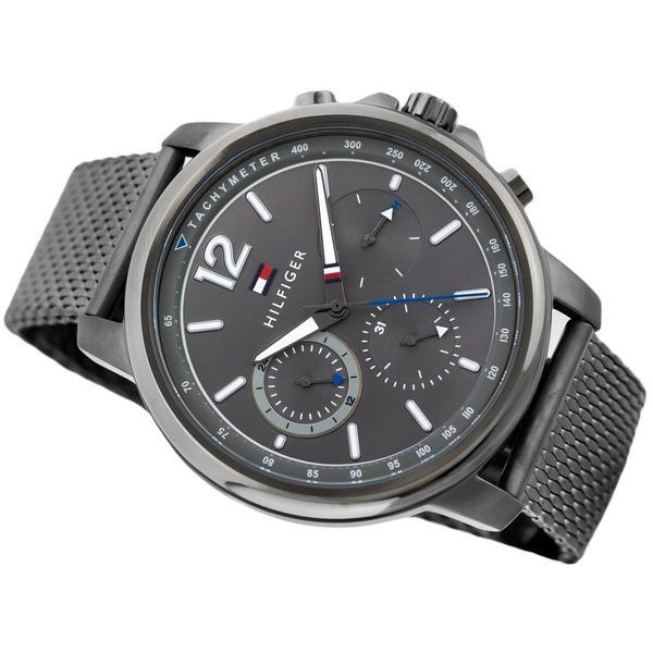 Close-up detail of grey chronograph dial with subdials and Hilfiger branding