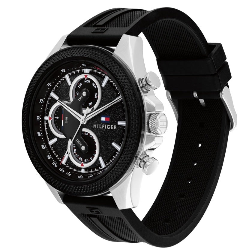 Tommy Hilfiger Clark watch at 45-degree angle showing black dial and silver case with strap