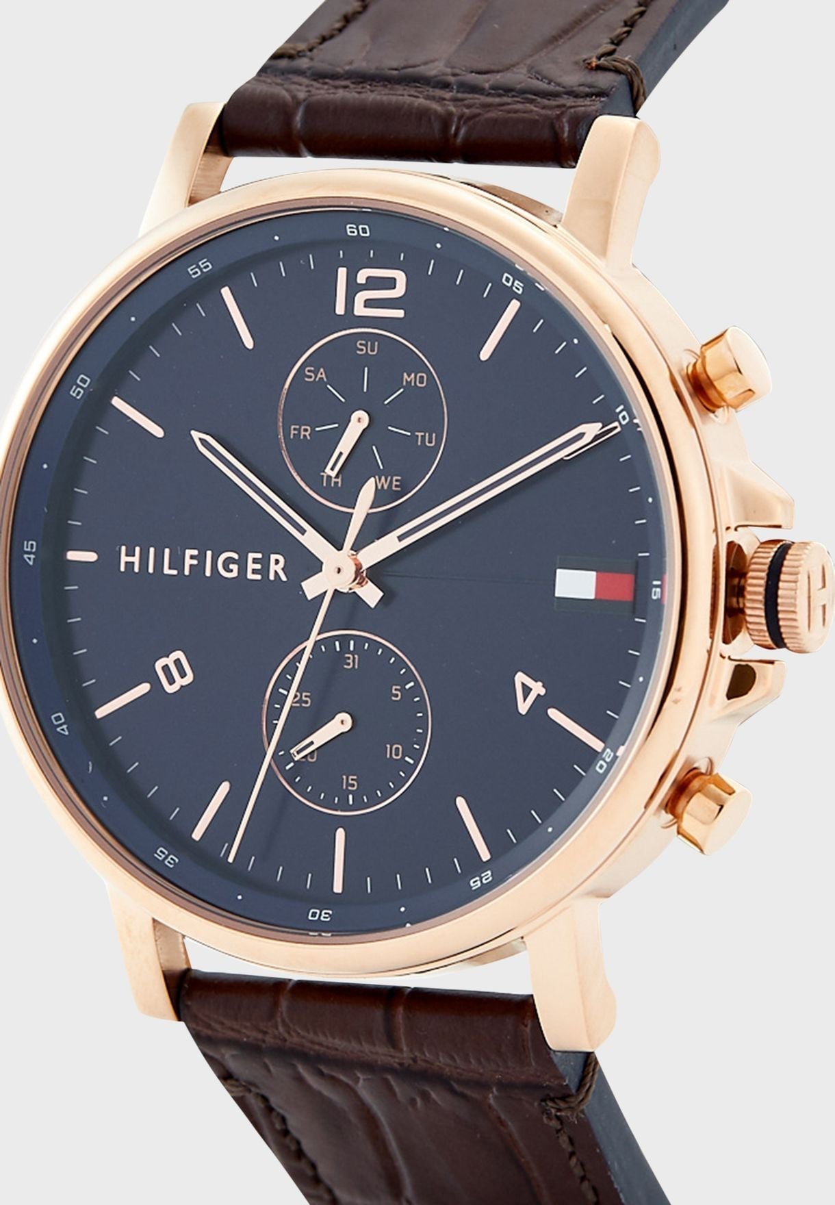 Angled view of Tommy Hilfiger Daniel chronograph watch showing chronograph dials and rose gold pushers